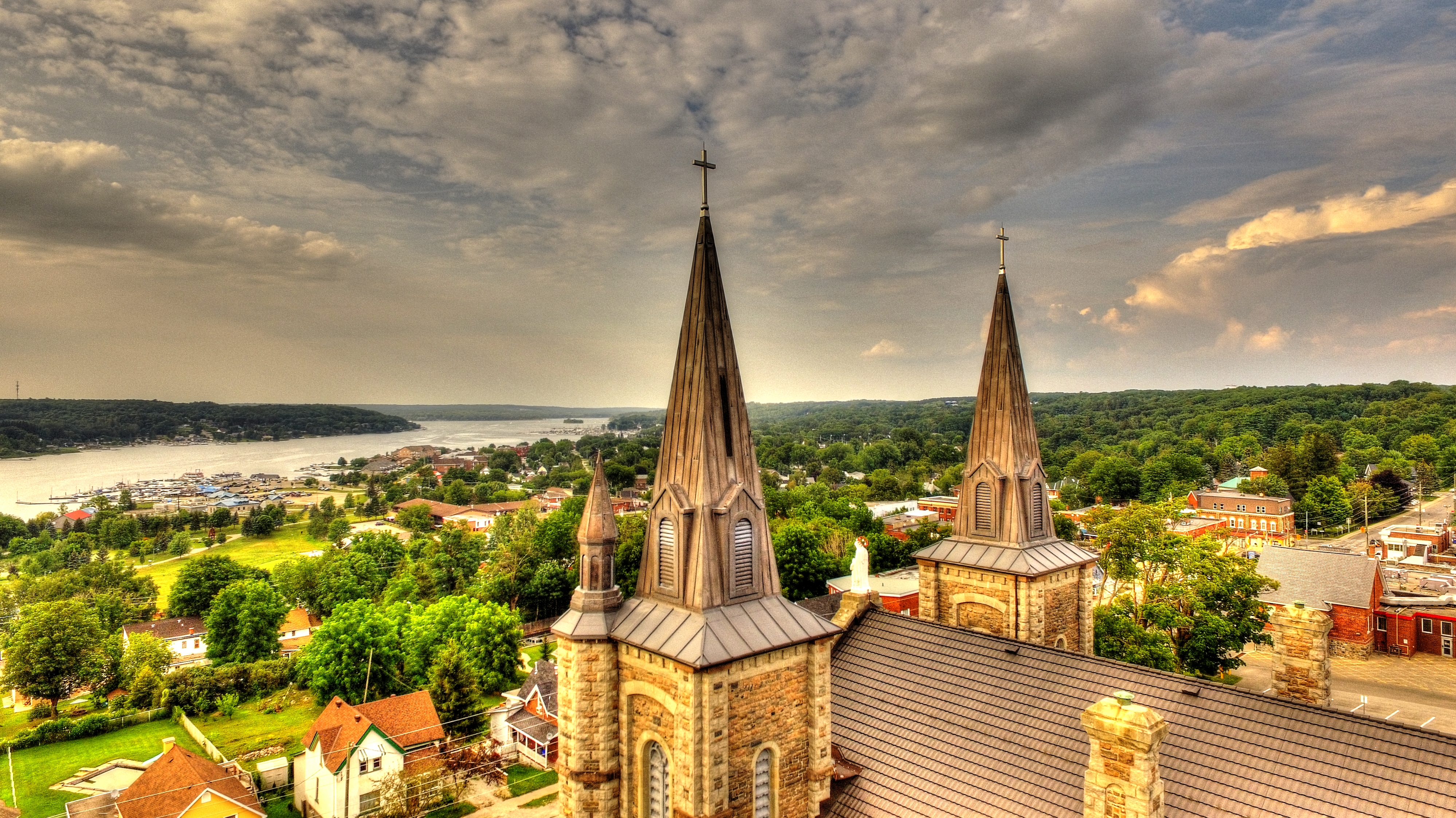 Drone of St. Ann's Church by the steeples with a view over georgian bay